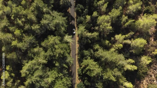 Car on a lonely road. Drone Shot.