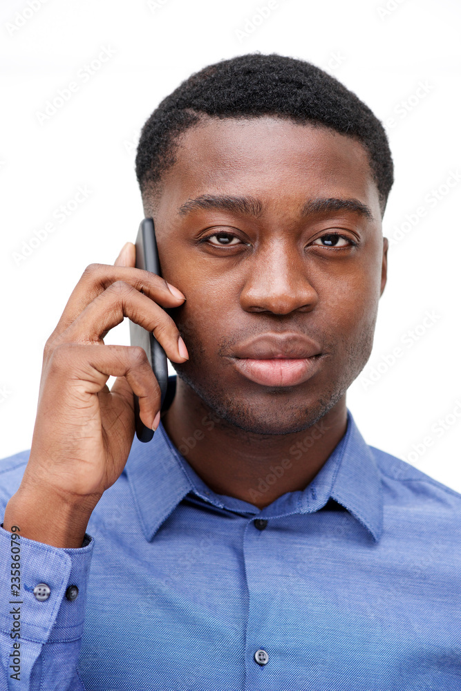 Close up young black man talking on cellphone Close up young black man talking on cellphone
