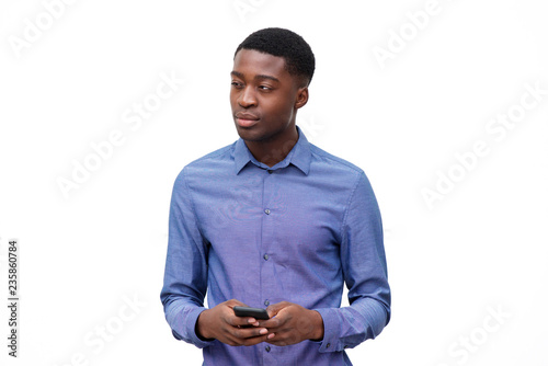 young african american man in blue shirt holding cellphone against isolated white background