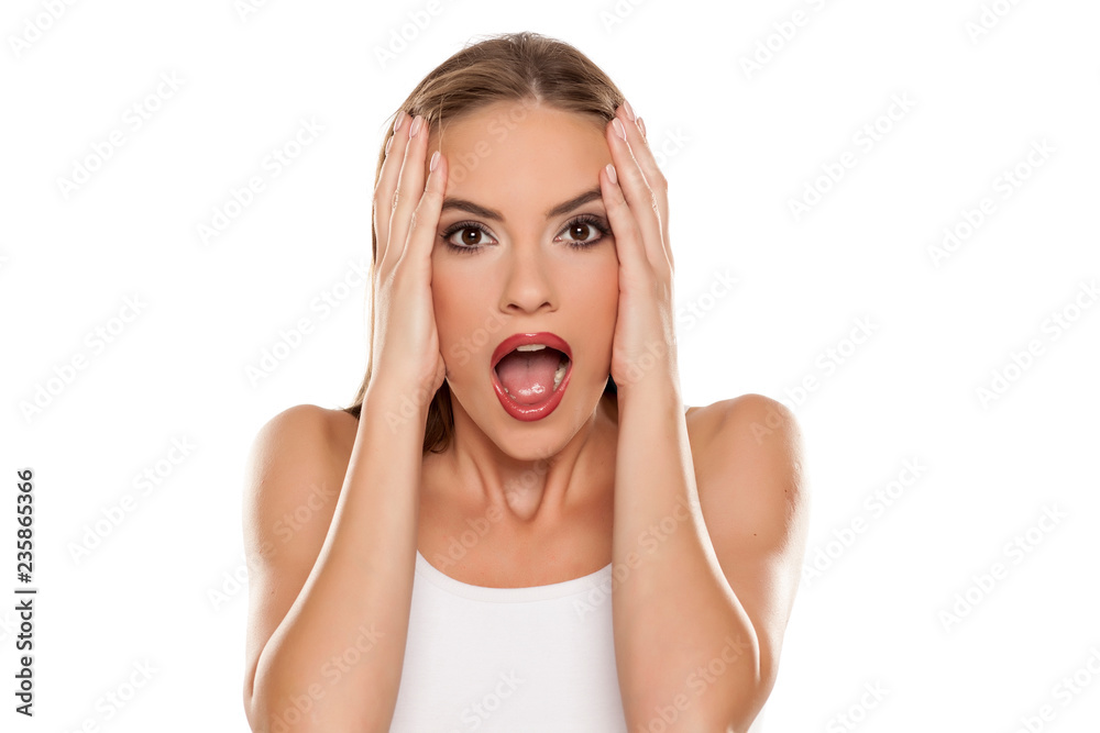 Beautiful shocked girl on white background Beautiful shocked girl on white background