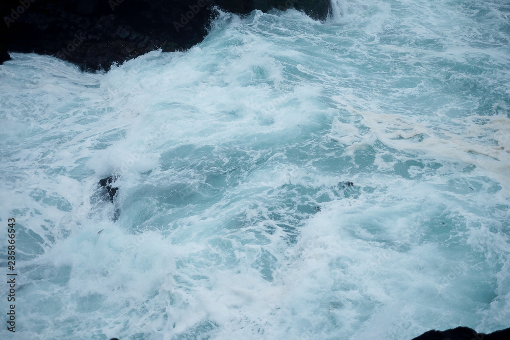 Ocean water and black stones Ocean water and black stones