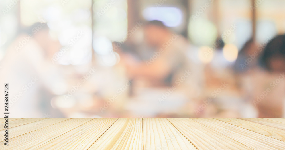 Empty Wood table top with Restaurant cafe or coffee shop interior with customer blur abstract vintage style bokeh light for montage product display background Empty Wood table top with Restaurant cafe or coffee shop interior with customer blur abstract vintage style bokeh light for montage product display background