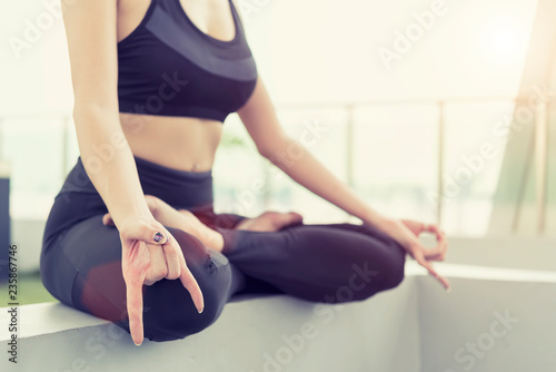 Healthy and relaxation concept. Closeup of sport woman doing yoga pose on mat in park. Lifestyle in holiday.