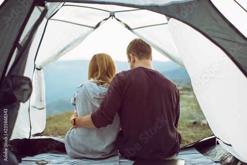 Young couple camping on mountain 