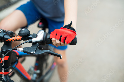Closeup of a young boy riding his bike