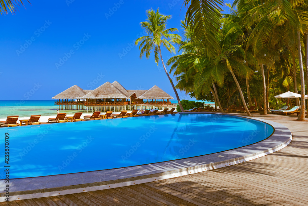Pool and cafe on Maldives beach Pool and cafe on Maldives beach