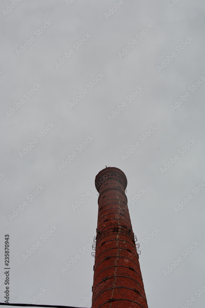 brick tower at the old building against the sky