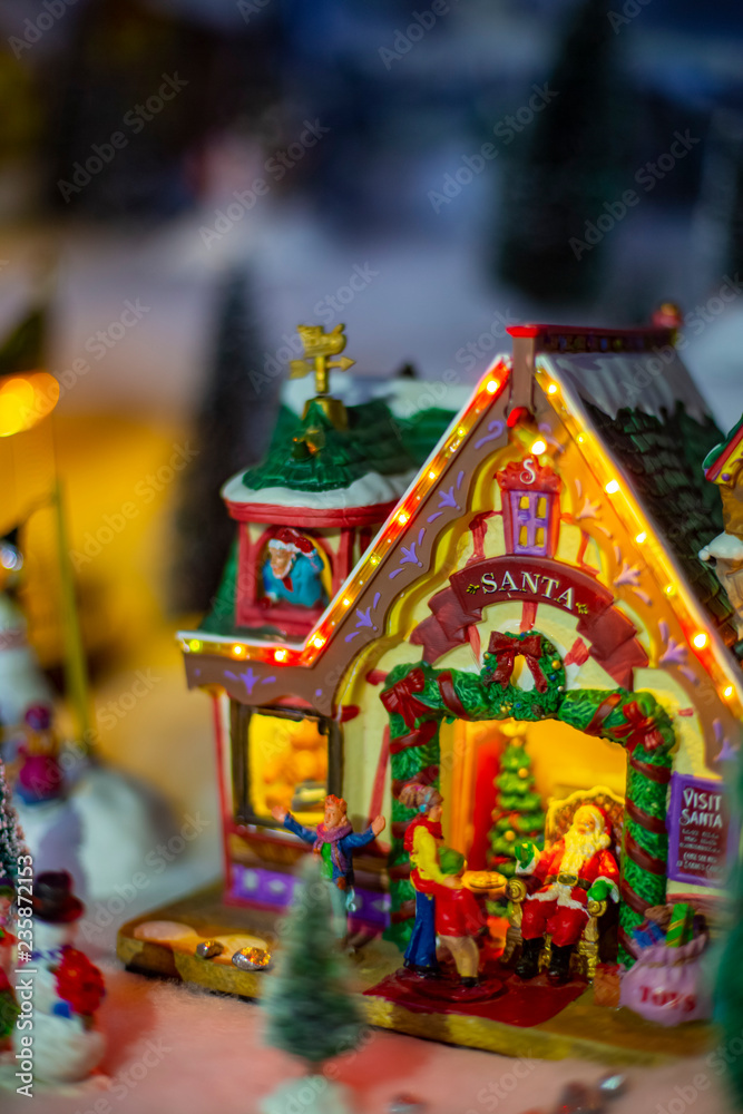 Naklejka premium Vintage Christmas santa holiday house glows in the dark tree toy decorations