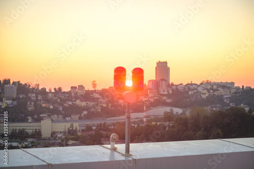 red lights on the roof of a high-rise building for the safety of buildings and air transport