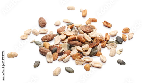 Healthy food mix of salted and spicy peanuts, sunflower and pumpkin seeds, almonds isolated on white background