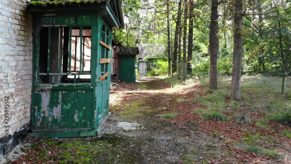 White Door at the Entrance to the Old Building, Old Destroyed Building in the Forest, Overgrown Trail, USSR White Door at the Entrance to the Old Building, Old Destroyed Building in the Forest, Overgrown Trail, USSR