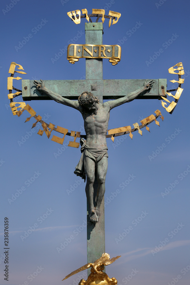 Prague, Czech Republic, September 17, 2018. Sculpture of the Crucifix on the Charles Bridge