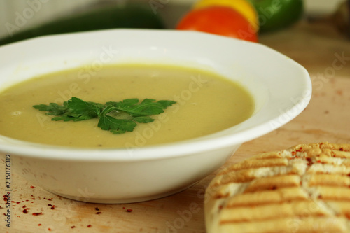 Cream soup with lentil with parsley and fresh bread