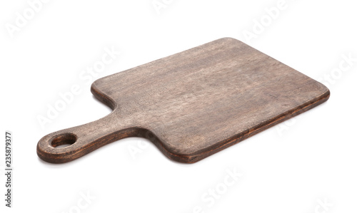 Wooden cutting board on white background photo