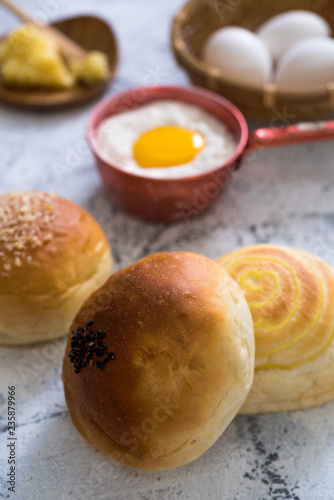 Traditional breads with ingredients on bright background