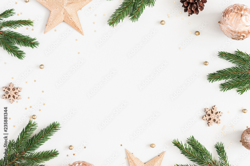 Christmas composition. Fir tree branches, golden decorations on pastel gray background. Christmas, winter, new year concept. Flat lay, top view, copy space - obrazy, fototapety, plakaty 