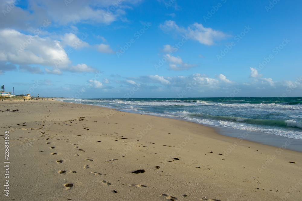 Landscape of a beach in north perth in a windy day full of waves water