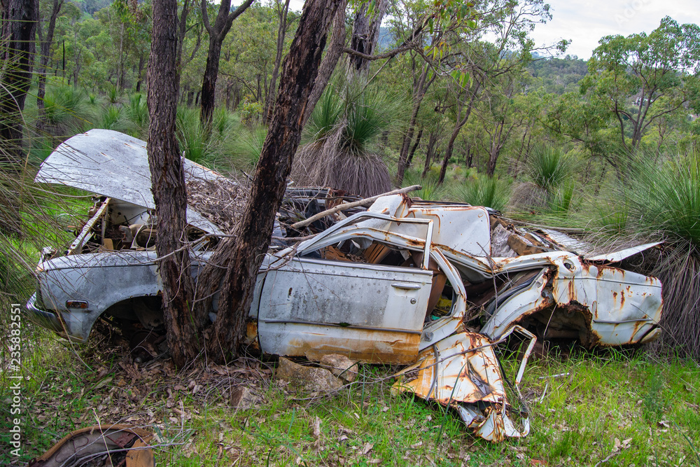 Abandoned and old car in the middle of the nature on Perth surroundings Abandoned and old car in the middle of the nature on Perth surroundings