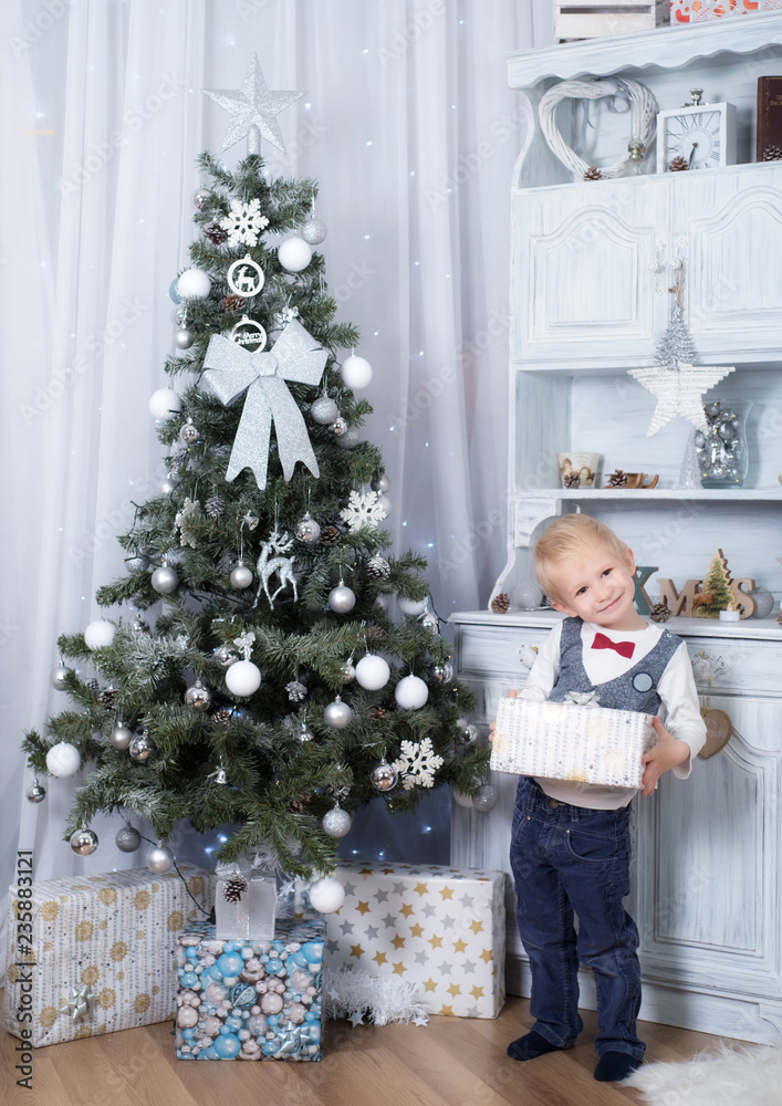 Adorable child holding a gift box
