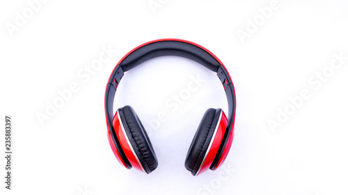 Wireless headphones closeup on white background with selective focus and crop fragme