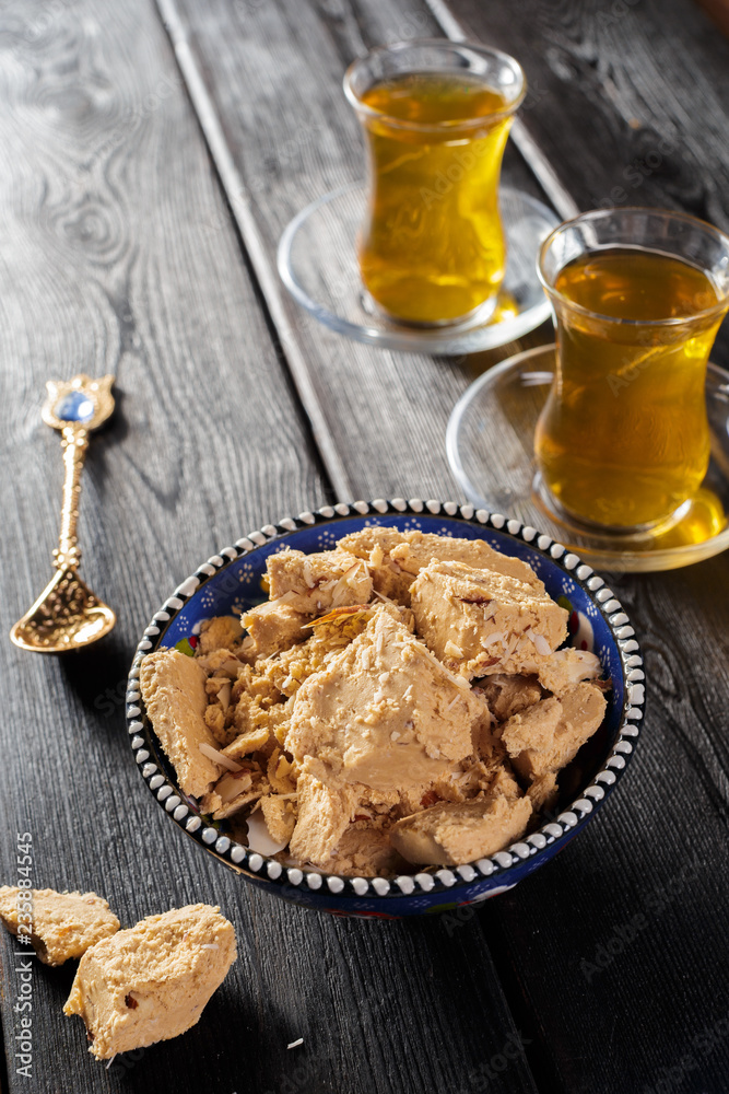 Fototapeta premium Tasty halva with tea on the table