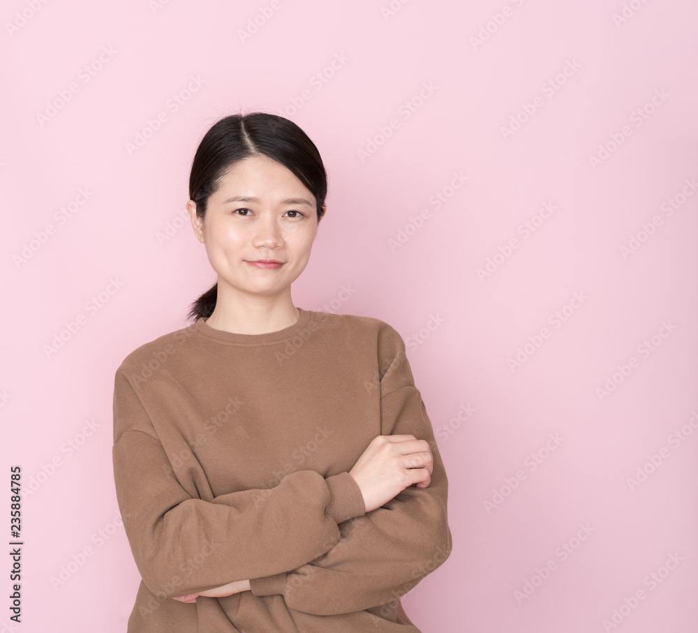 Asian female on pink background