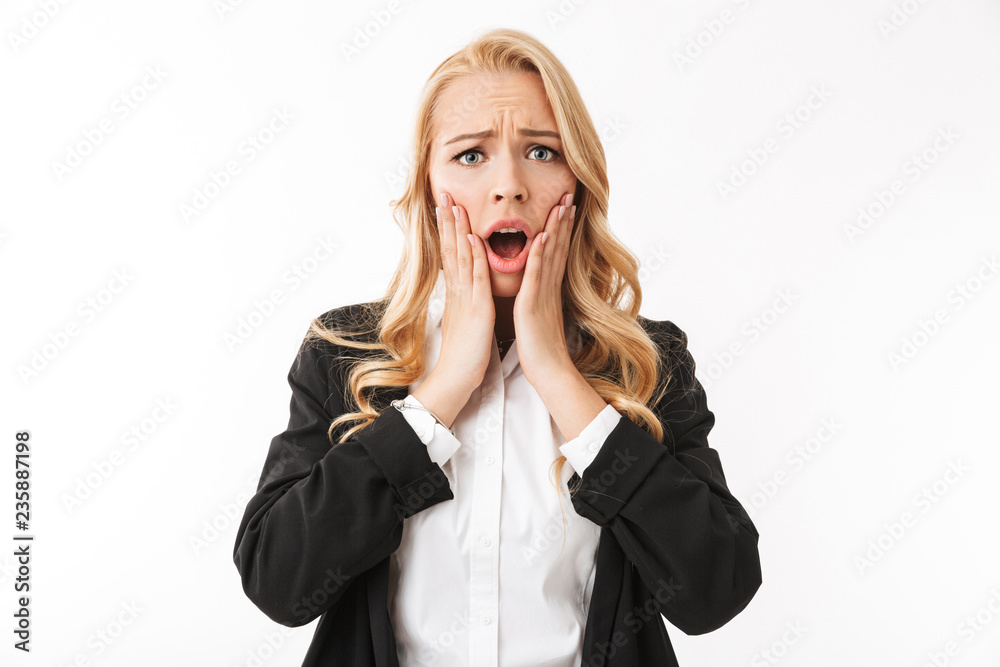 Shocked sad business woman posing isolated over white background wall. Shocked sad business woman posing isolated over white background wall.