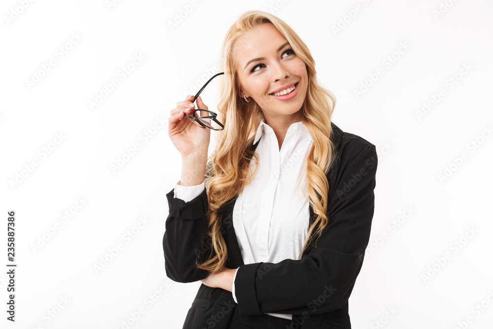 Photo of joyous businesswoman wearing office suit smiling and holding eyeglasses, isolated over white background in studio Photo of joyous businesswoman wearing office suit smiling and holding eyeglasses, isolated over white background in studio