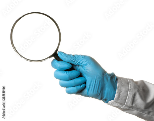 Woman doctor's hand is holding a magnifying glass on a white isolated background. hand gestures