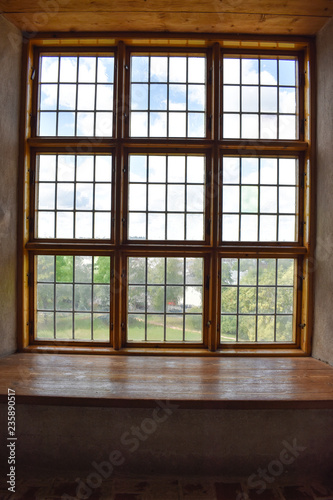 Wooden and glass window overlooking a garden