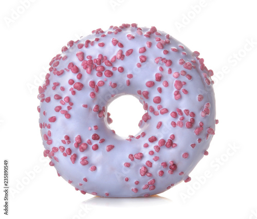 Sweet donut with a lilac-colored icing and sprinkle close up on a white isolated background
