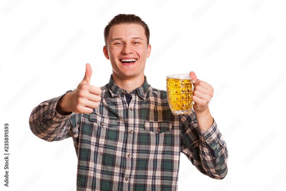 Happy young man looking excited, smiling to the camera, showing thumbs up while holding a glass of beer isolated on white. Excited man posing with a drink. Celebration, brewery. leisure concept Happy young man looking excited, smiling to the camera, showing thumbs up while holding a glass of beer isolated on white. Excited man posing with a drink. Celebration, brewery. leisure concept