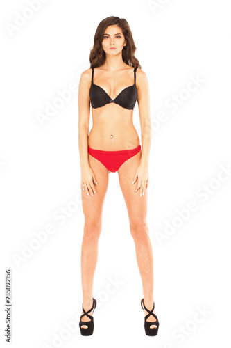 Full length portrait of young woman wearing sexy underwear