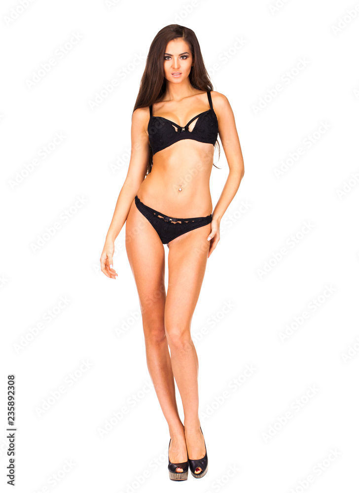 Fototapeta premium Full portrait of sexy lady in black lingerie, isolated on white background