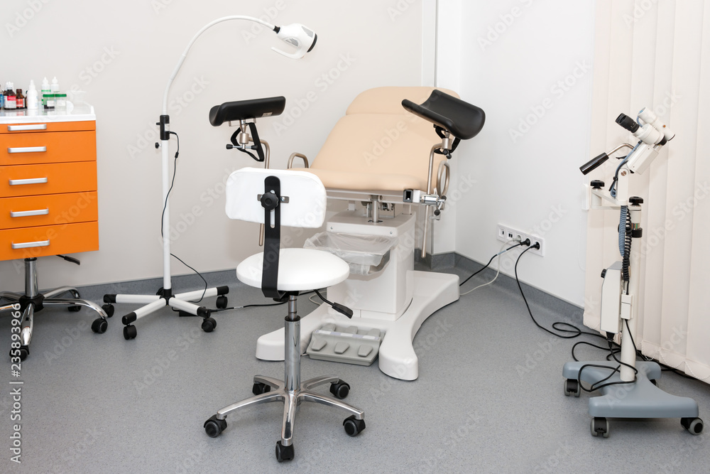 Gynecological cabinet with chair and other medical equipment in modern clinic. Equipment medicine, medical furniture, hospital, genicology, women's consultation Gynecological cabinet with chair and other medical equipment in modern clinic. Equipment medicine, medical furniture, hospital, genicology, women's consultation