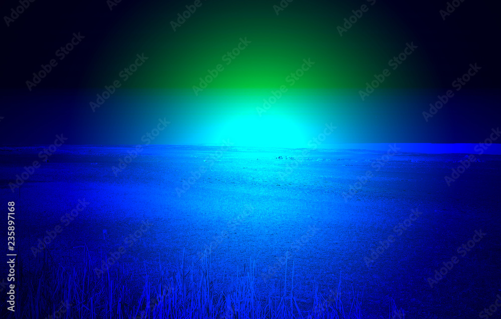 photomanipulation of the sun rising above the alien planet in blue tones