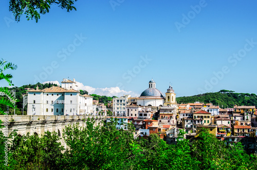 The houses of the city of Ariccia with beautiful red roofs under the blue sky. Rome. Italy.
