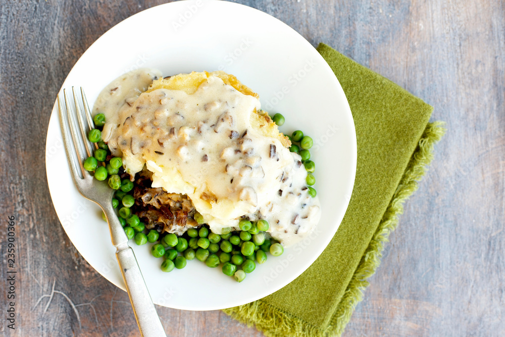 Shiitake Mushroom Wild Rice Shepard's Pie served with Peas and Gravy. Shiitake Mushroom Wild Rice Shepard's Pie served with Peas and Gravy.
