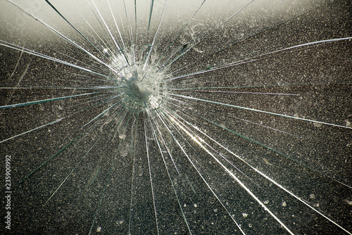 Glass with cracks from point impact