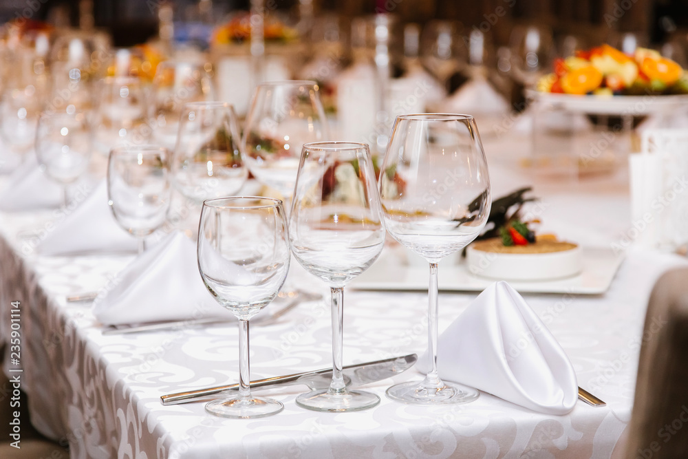 Table setting for many people, wine glasses