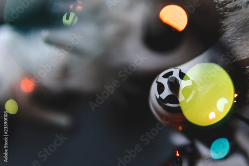 bokeh, selective focus, Best Christmas pressent, gift Drone on a gray wooden table background. lights bokeh, top view, Christmas lights, colorful lights, concept of sales