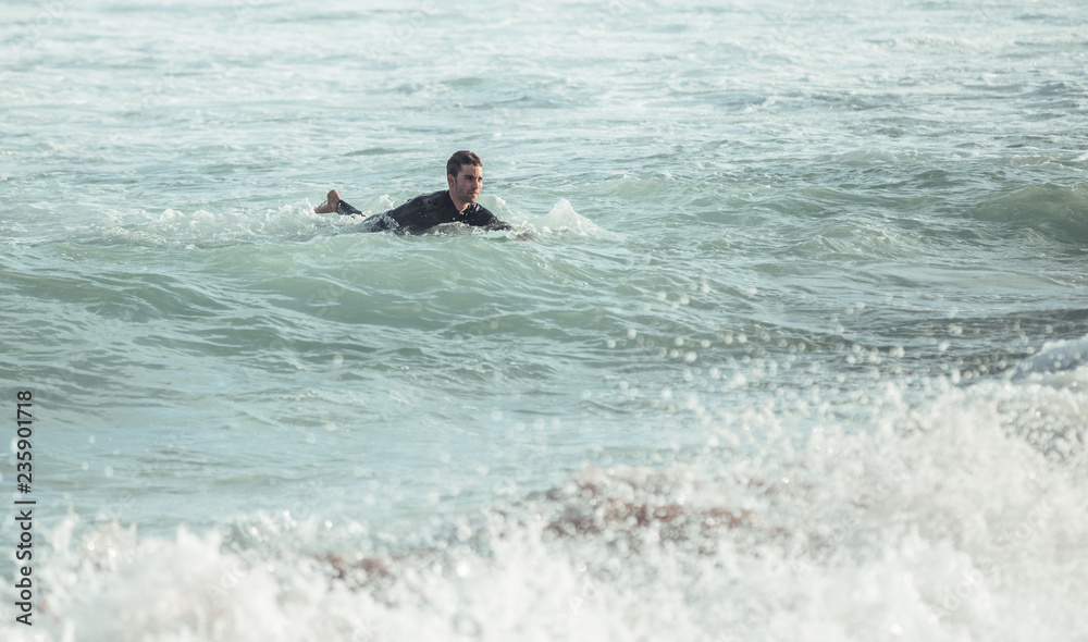 Cheerful man with surfboard on beach Cheerful man with surfboard on beach