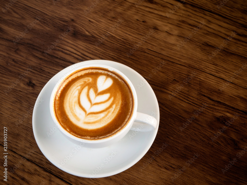 Hot coffee with soft bubble on old wooden boards. Hot coffee with soft bubble on old wooden boards.
