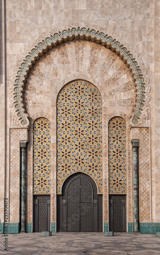 The Hassan II Mosque in Casablanca, Morocco. Ornate exterior brass door. Hassan II Mosque is the largest mosque in Morocco and one of the most beautiful. the 13th largest in the world.