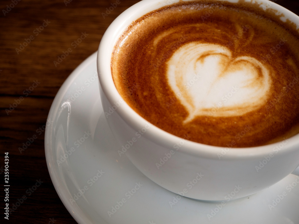 Hot coffee with soft bubble on old wooden boards. Hot coffee with soft bubble on old wooden boards.