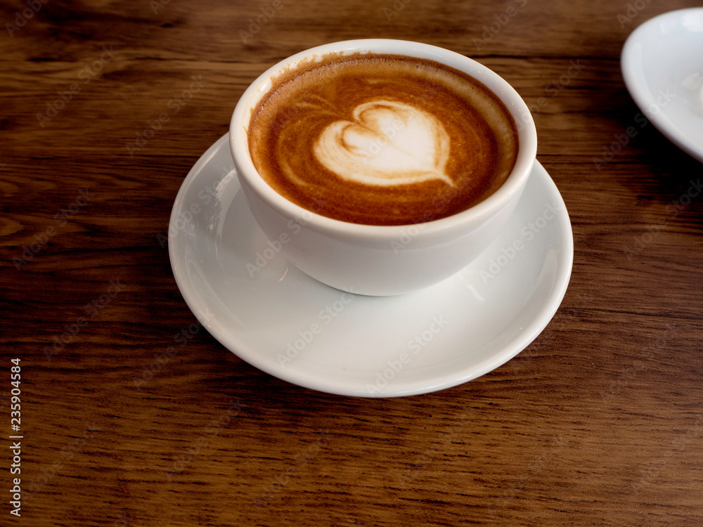 Hot coffee with soft bubble on old wooden boards. Hot coffee with soft bubble on old wooden boards.