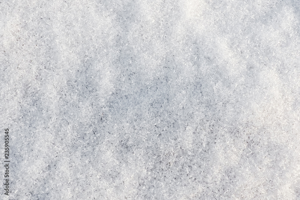 Background of crystal snow. White fresh snowy texture.