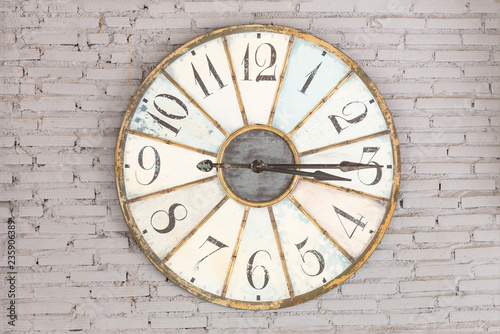 Retro clock showing three fifteen on the wall