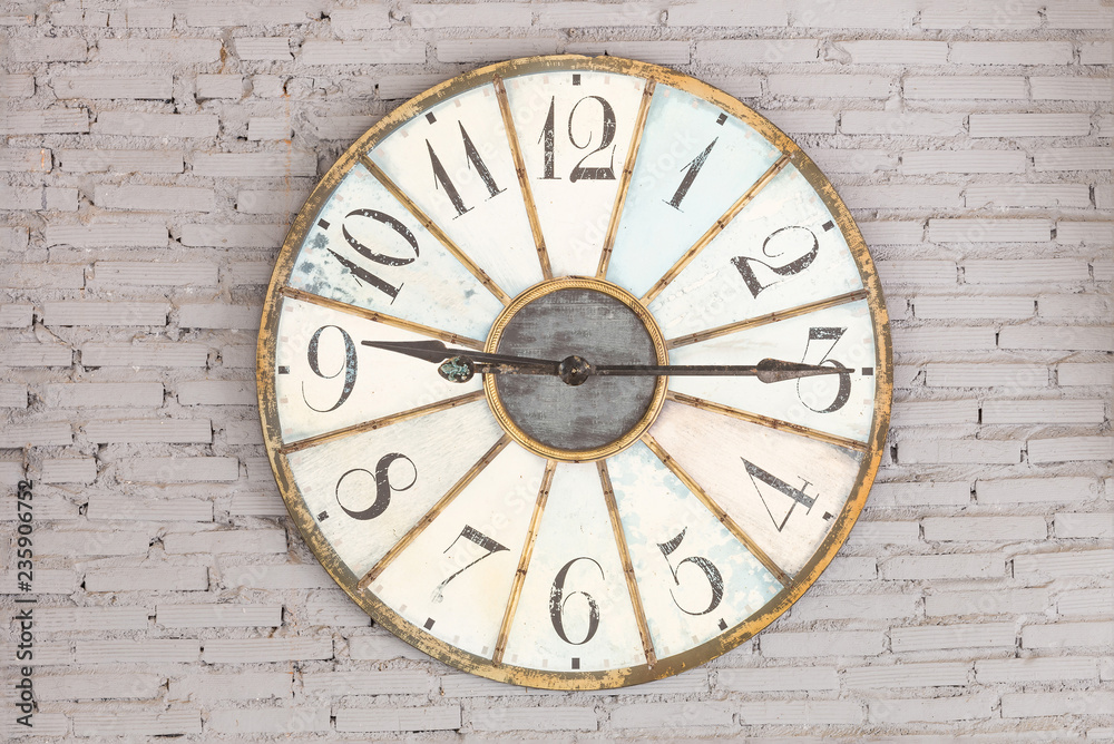 Retro clock showing nine fifteen on the wall Retro clock showing nine fifteen on the wall