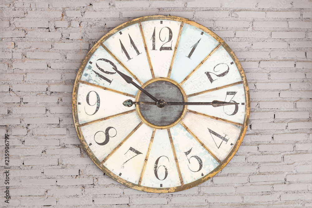 Retro clock showing ten fifteen on the wall